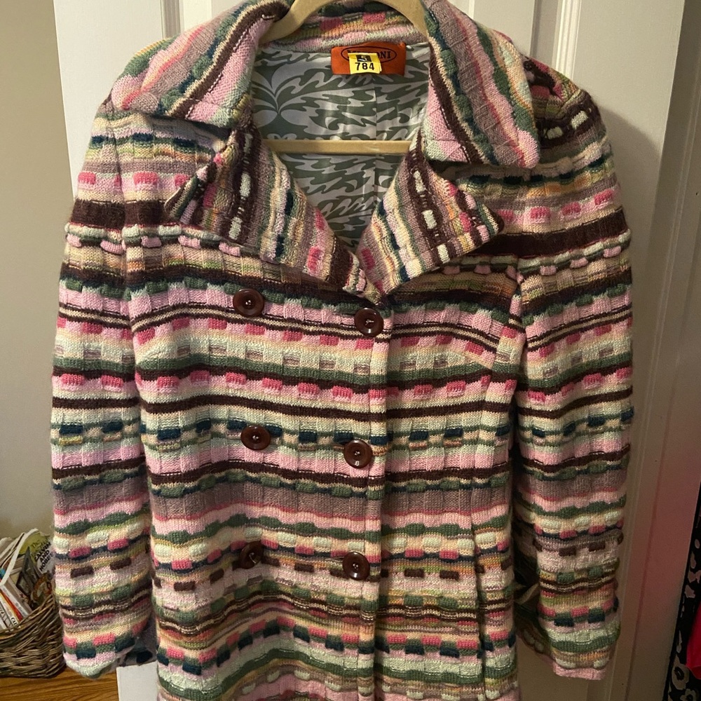 Gently used. Was just dry cleaned. Made in Italy